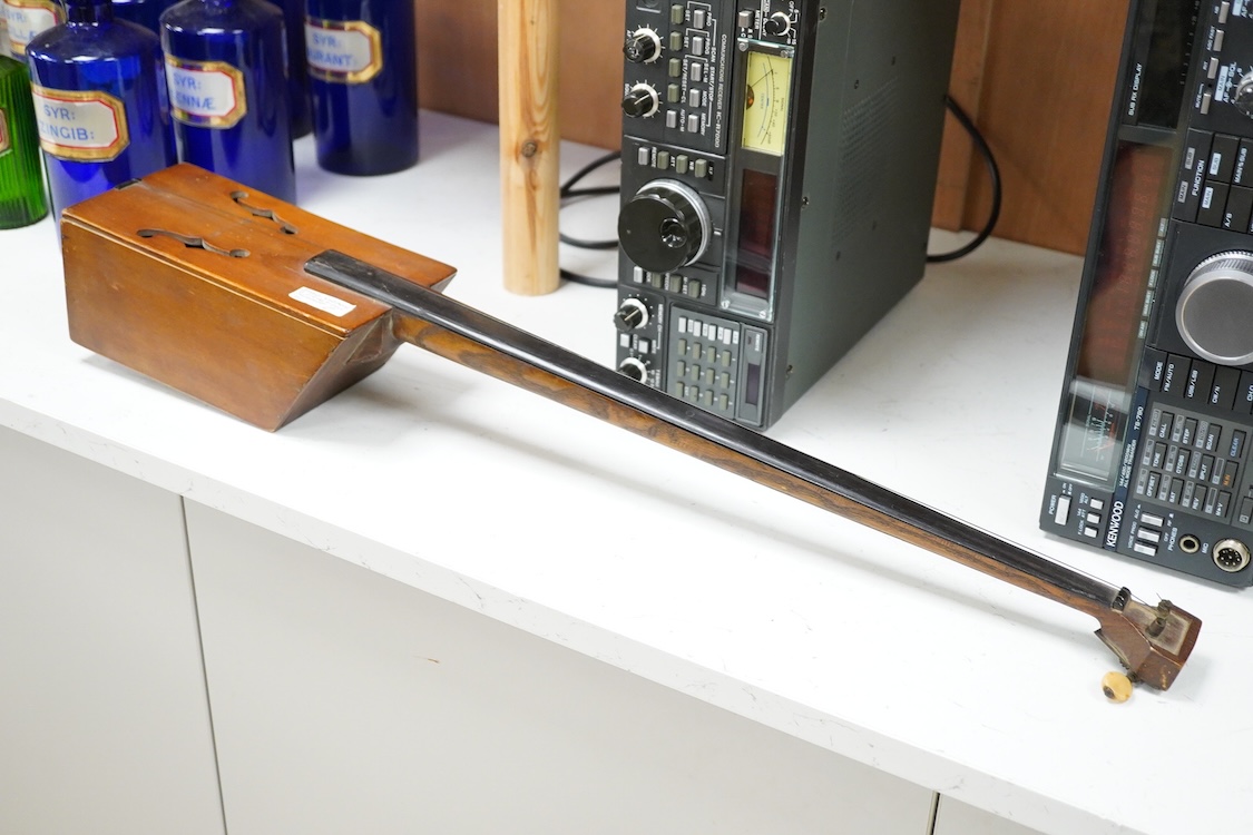 A Mongolian two stringed Morin Khuur musical instrument, 71cm overall